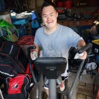 SOBC – Kamloops athlete Shinji Matthews makes his kilometres count on an elliptical machine.
