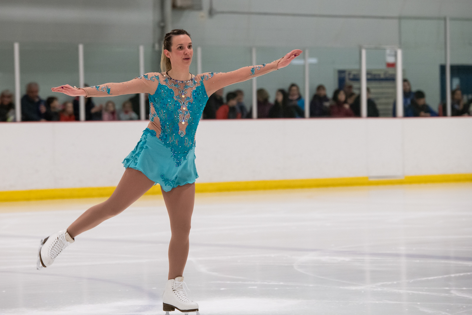 Figure skating athletes with intellectual disabilities performs their routine on the ice.