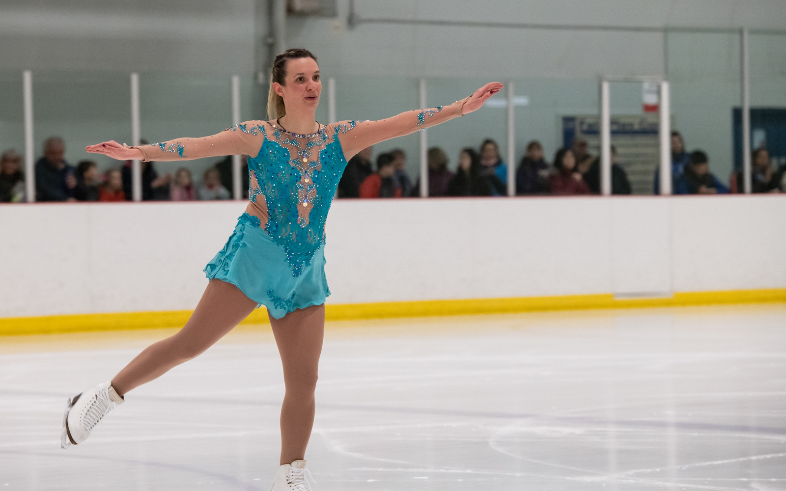 Figure skating athletes with intellectual disabilities performs their routine on the ice.