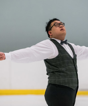 A Special Olympics BC athlete throwing a curling rock.