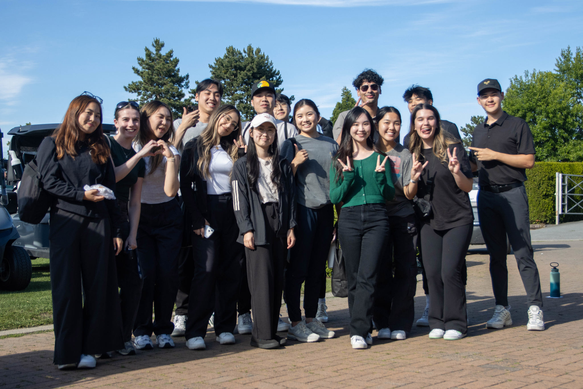 A group of volunteers pose together outside the clubhouse.