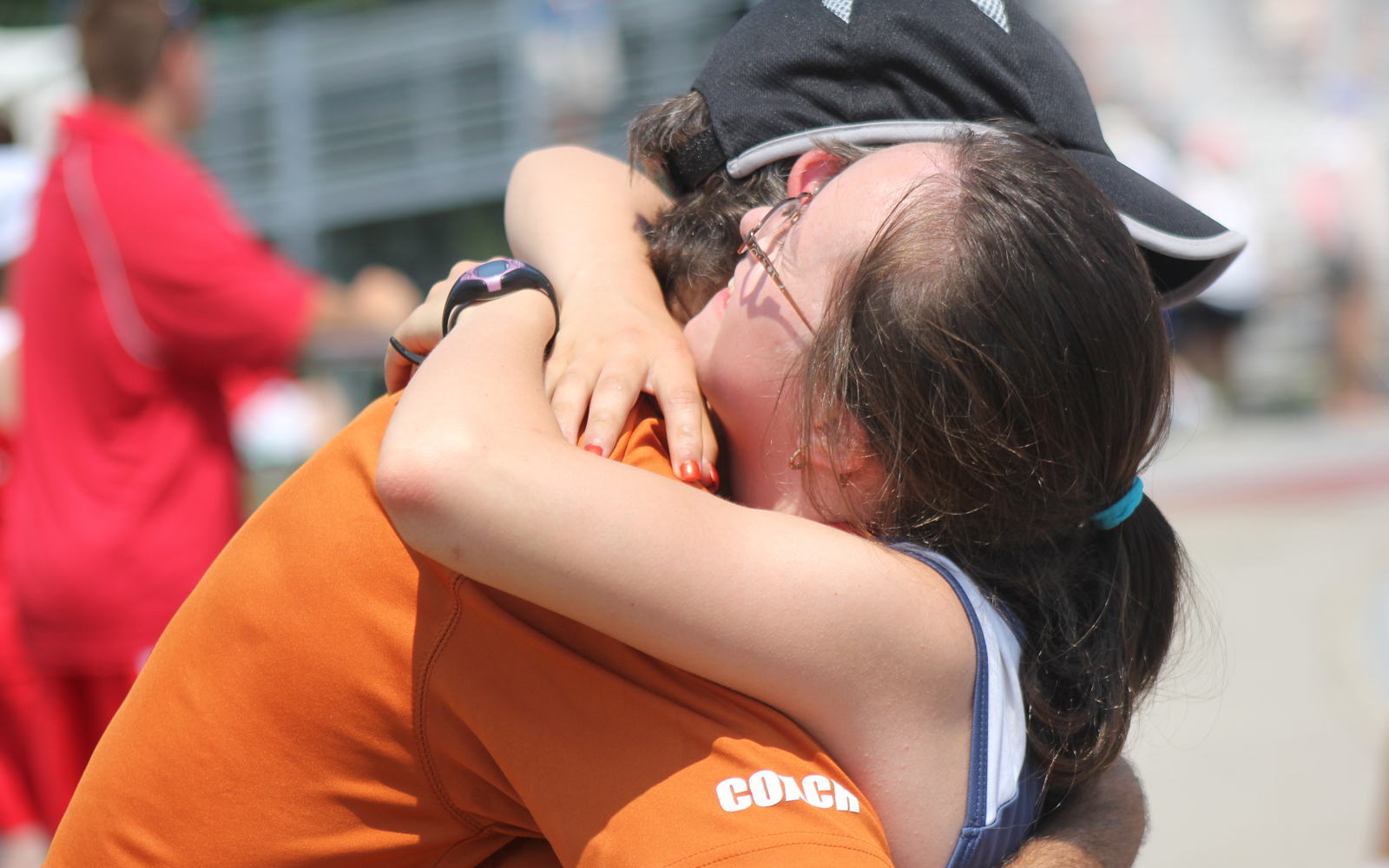 Special Olympics BC coach gives a congratulatory hug to their athlete.