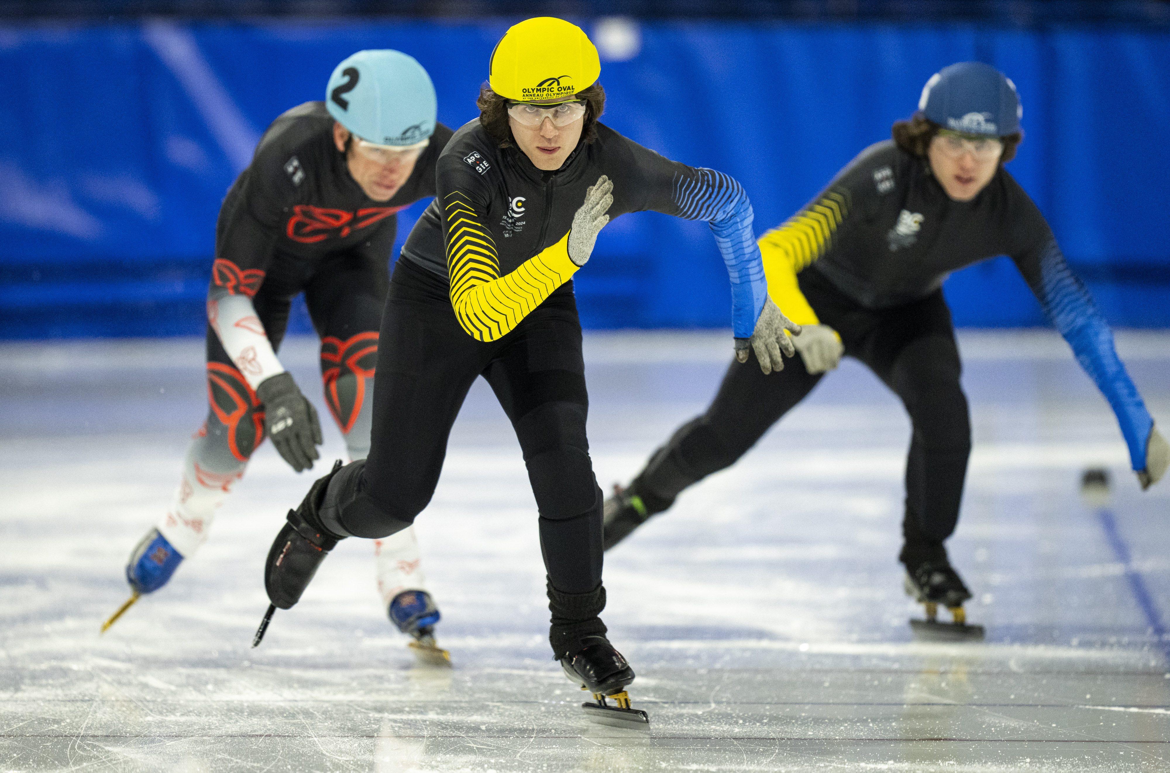 Two Team BC athletes charge down the straight-away at a speedskating race at the 2024 Special Olympics Canada National Winter Games in Calgary.